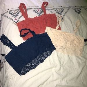 Three bralets with removable straps.